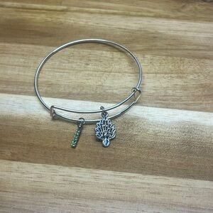 silver adjustable bangle bracelet with peacock and green diamond charms